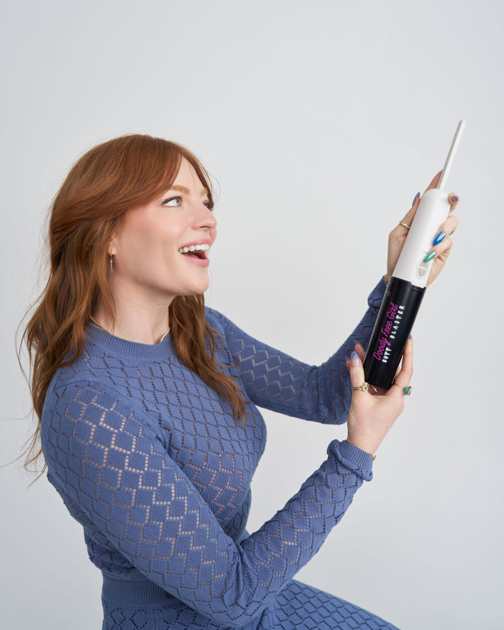 redhead using electric portable bidet butt blaster